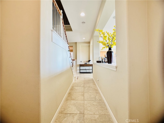 hallway with light tile patterned flooring