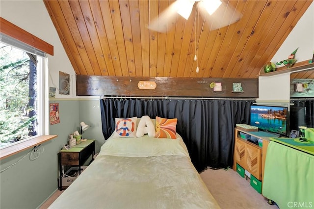 carpeted bedroom with vaulted ceiling