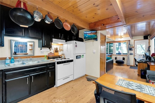 kitchen with white appliances, range hood, wood ceiling, dark cabinets, and light wood-style flooring