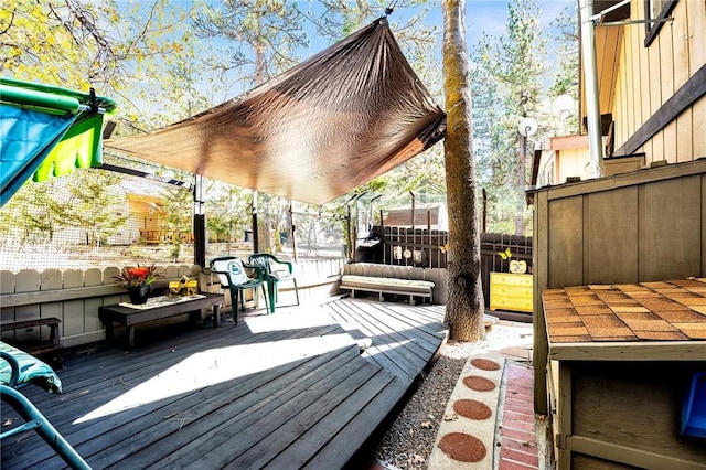 wooden deck featuring fence