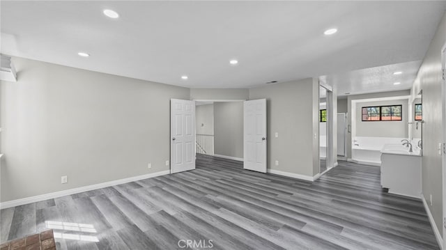 unfurnished living room with hardwood / wood-style floors