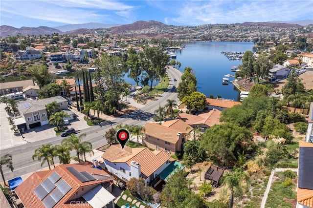 drone / aerial view featuring a water and mountain view