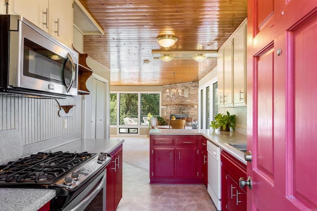 kitchen featuring wood ceiling, vaulted ceiling, and stainless steel appliances