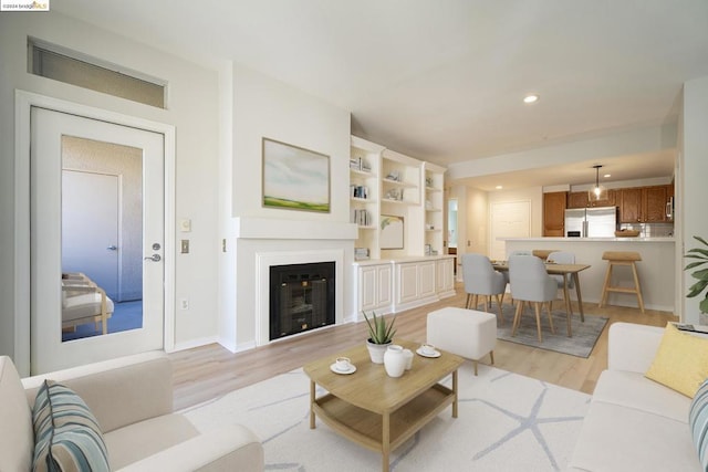 living room with light hardwood / wood-style flooring