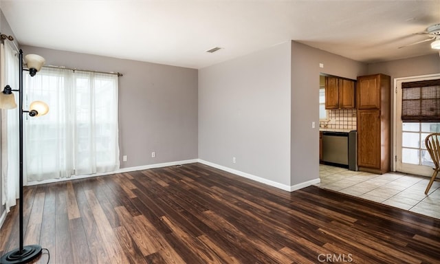 unfurnished living room with light hardwood / wood-style flooring and ceiling fan