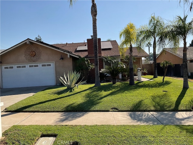 single story home featuring a front yard and a garage