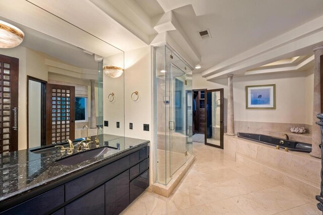 bathroom featuring vanity and shower with separate bathtub