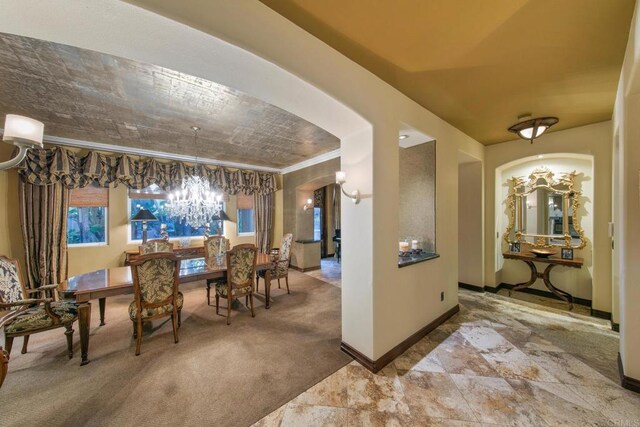 dining room featuring ornamental molding and carpet floors