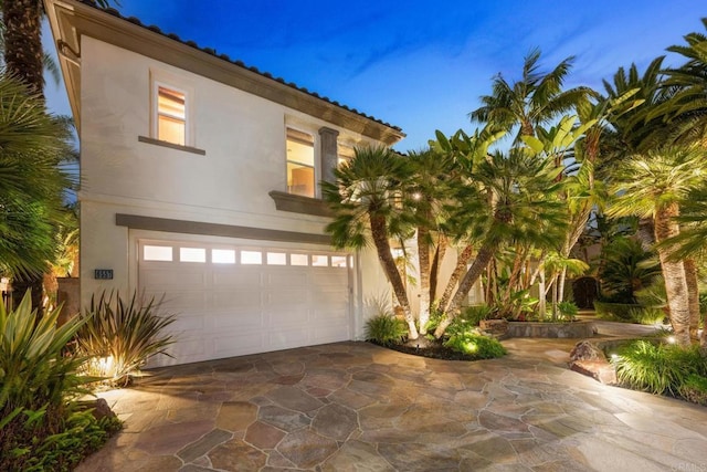 mediterranean / spanish-style house featuring a garage