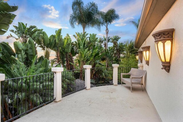 patio terrace at dusk with a balcony