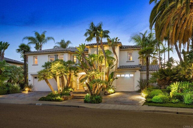 mediterranean / spanish-style home featuring a garage