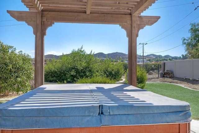 view of patio / terrace featuring a pergola and a mountain view