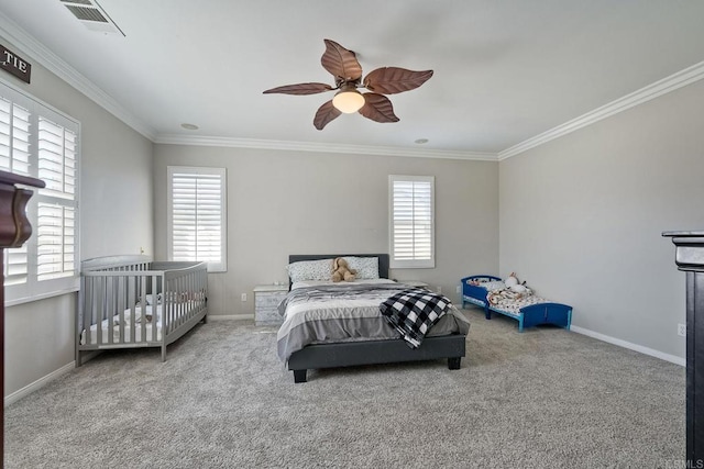 bedroom with crown molding, light carpet, and ceiling fan