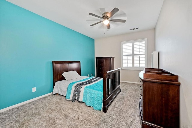 bedroom with light colored carpet and ceiling fan