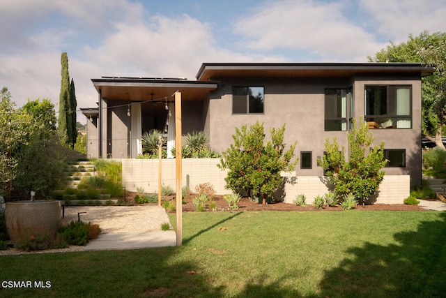 modern home with a front lawn