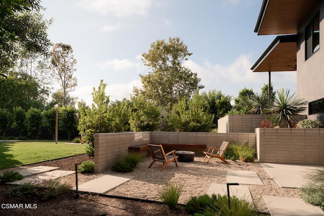 view of patio / terrace featuring an outdoor fire pit