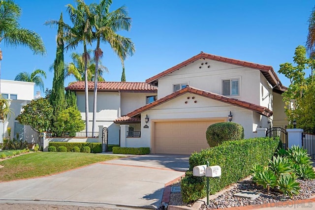 mediterranean / spanish house with a front yard