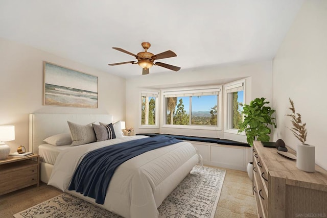 bedroom with light carpet and ceiling fan