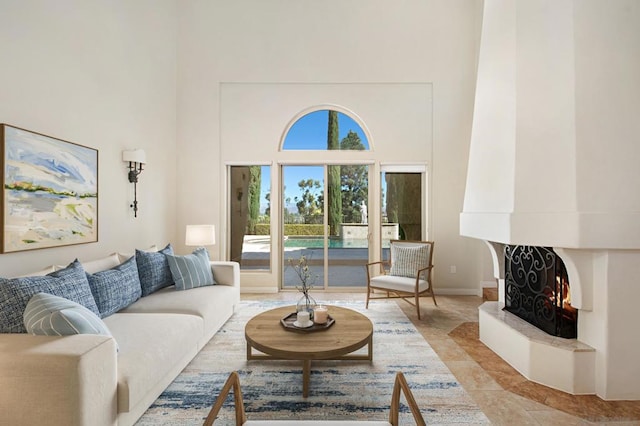 tiled living room with a high ceiling