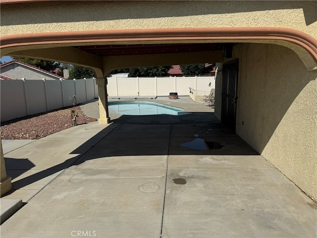 exterior space with a fenced in pool