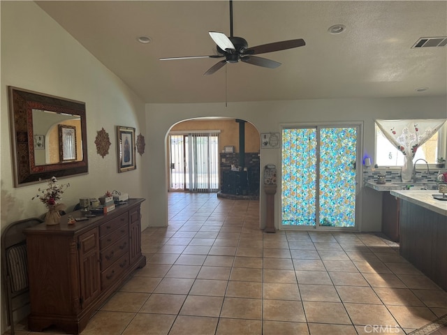 interior space featuring vaulted ceiling and ceiling fan