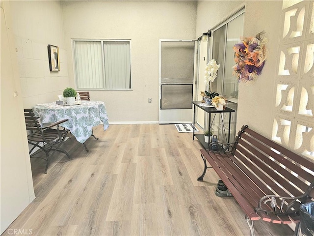 interior space featuring baseboards and wood finished floors
