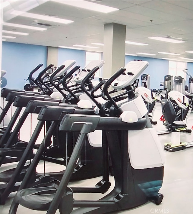 workout area with a paneled ceiling