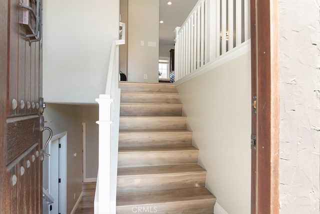 staircase featuring hardwood / wood-style flooring