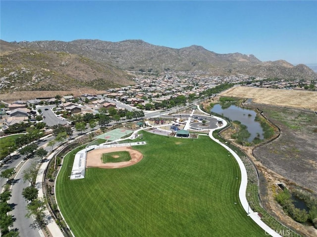 bird's eye view with a water and mountain view