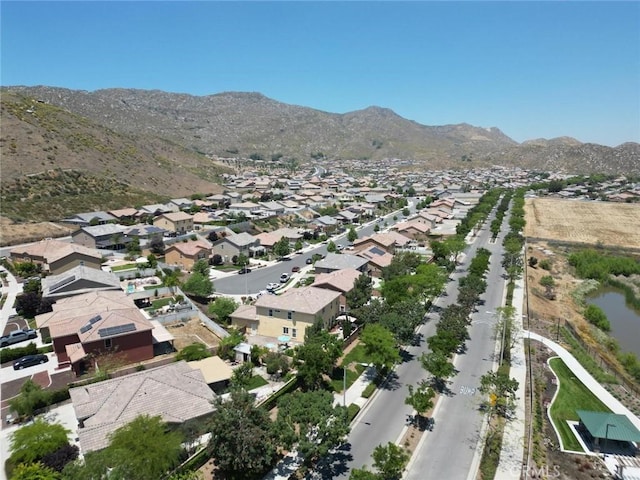 birds eye view of property with a mountain view