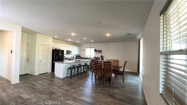 dining space featuring dark hardwood / wood-style floors