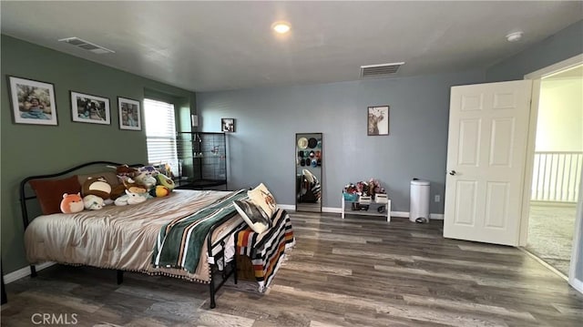 bedroom featuring dark hardwood / wood-style floors