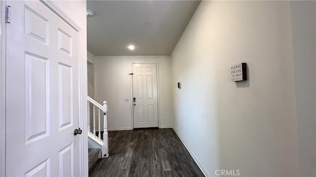 hallway featuring dark hardwood / wood-style flooring