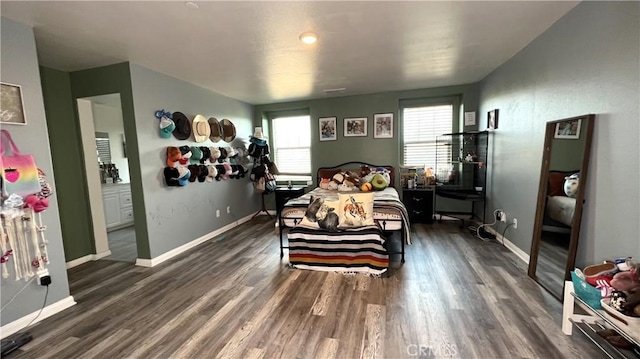 bedroom with dark wood-type flooring