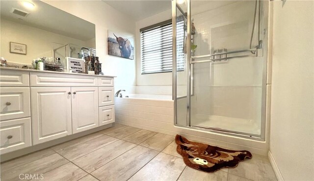 bathroom with vanity and plus walk in shower