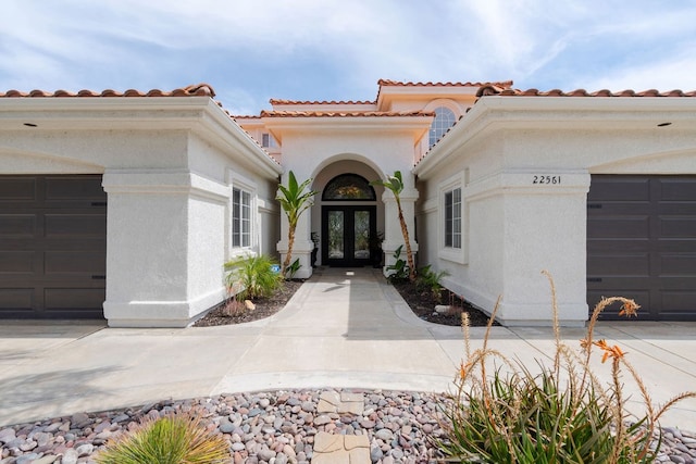 view of front of house featuring french doors and a garage