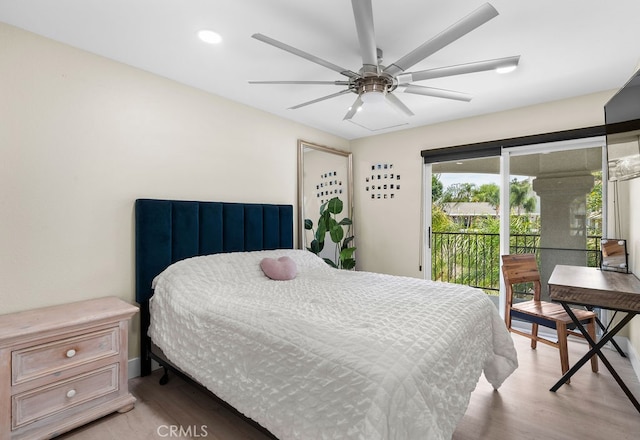 bedroom featuring access to exterior, ceiling fan, and light hardwood / wood-style flooring