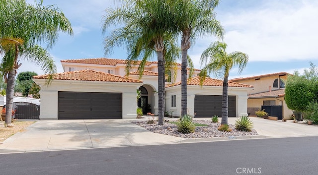 mediterranean / spanish-style home featuring a garage