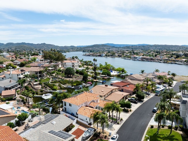 birds eye view of property featuring a water and mountain view