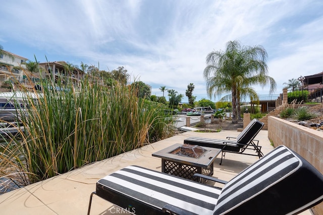 view of patio / terrace with a fire pit