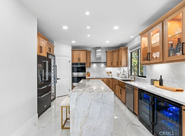 kitchen with decorative backsplash, stainless steel appliances, wall chimney range hood, and sink