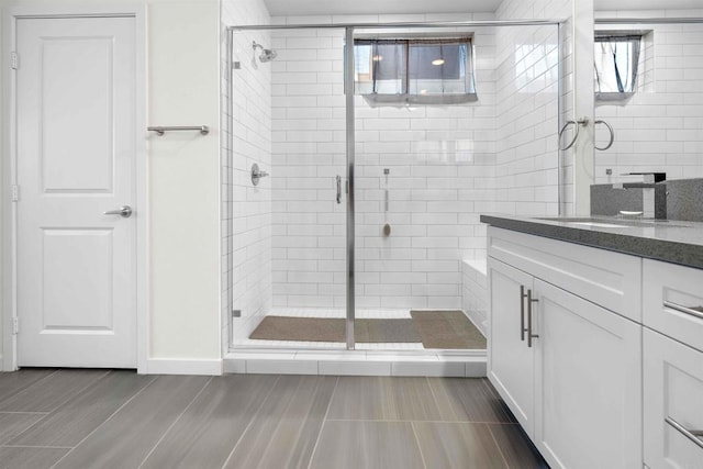 2013 Bravo Loop Unit 5, Chula Vista, CA 91915 - bathroom with healthy amount of natural light, a shower stall, and vanity
