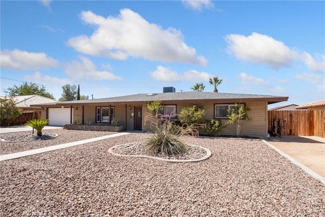 ranch-style home with covered porch and a garage