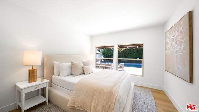 bedroom featuring light hardwood / wood-style floors