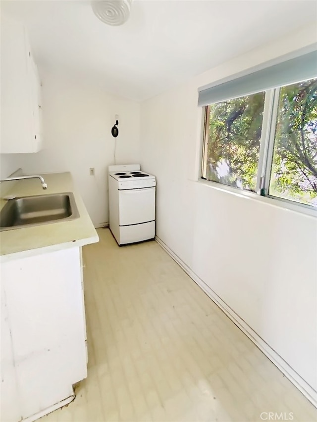 washroom with sink and washer / clothes dryer