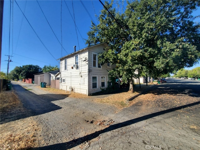 view of side of home featuring cooling unit