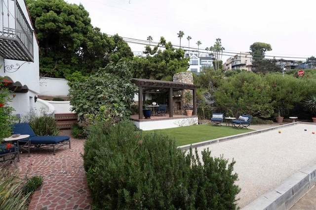 exterior space featuring a pergola, a patio, and a yard