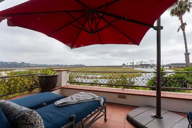 balcony featuring a water view