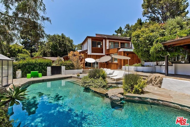 view of swimming pool featuring a patio