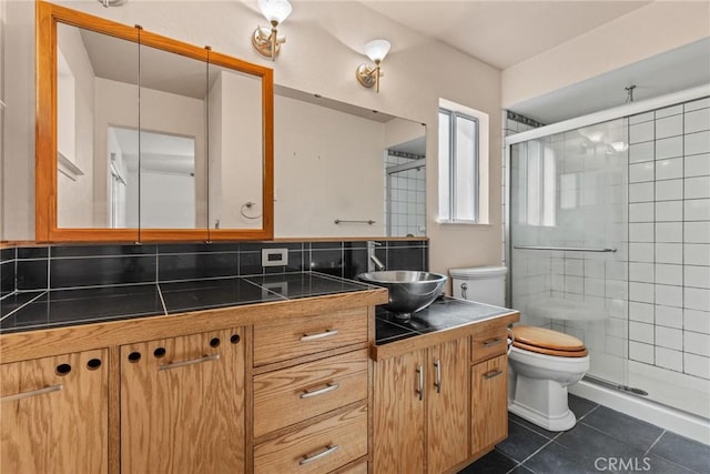 6032 Tiffin Ct, Magalia, CA 95954 - full bathroom featuring tile patterned floors, toilet, vanity, decorative backsplash, and a stall shower